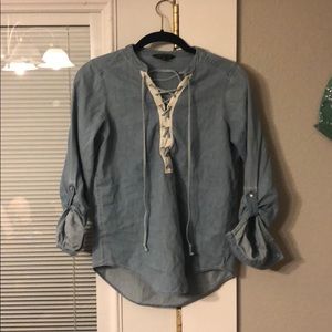 Denim shirt.